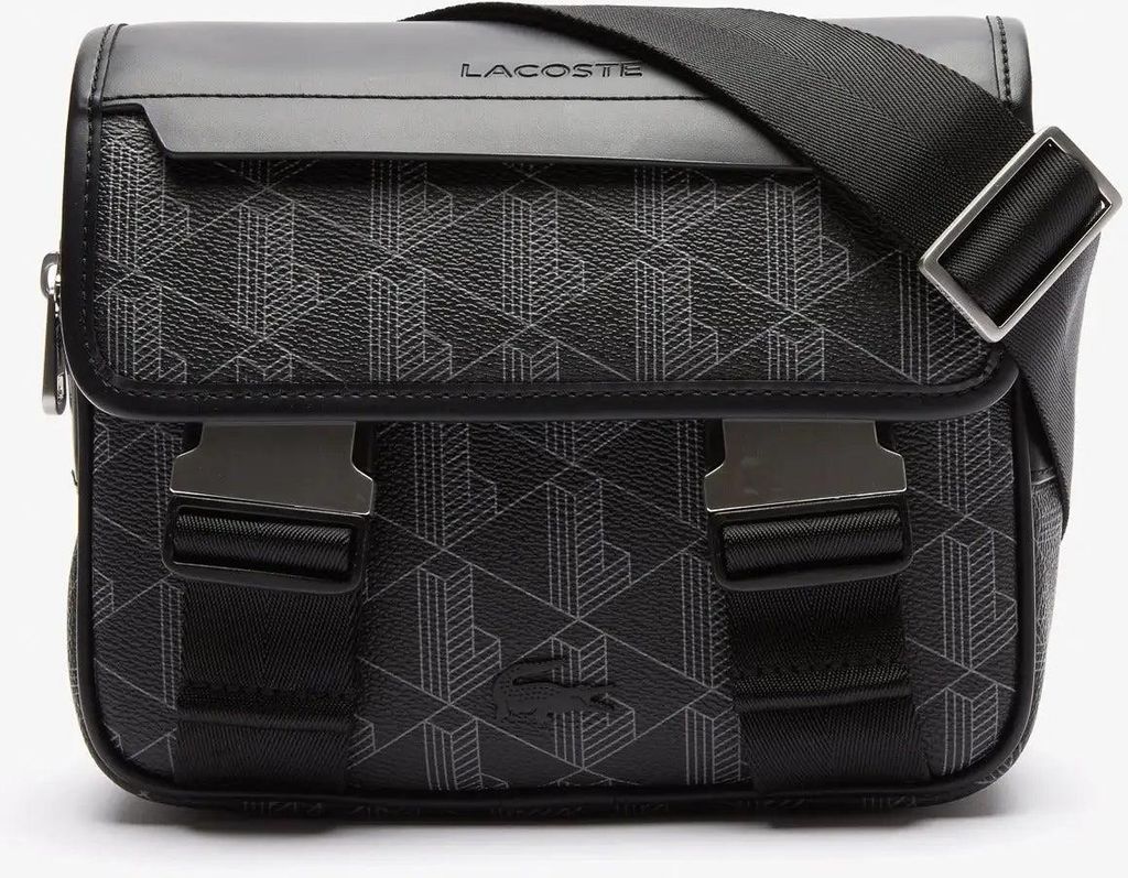A studio shot of a black Lacoste messenger bag with a geometric pattern.