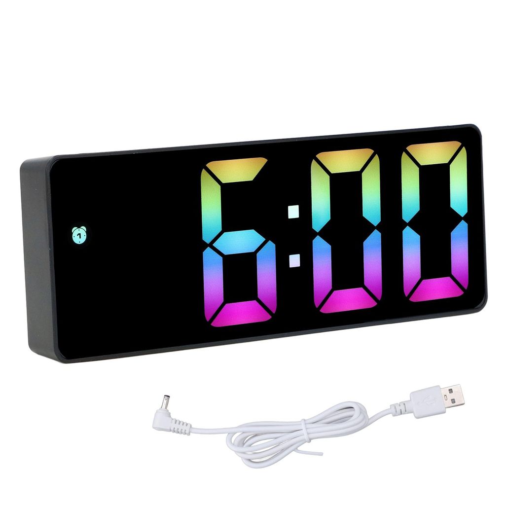A digital alarm clock with a colorful display and its charging cable.