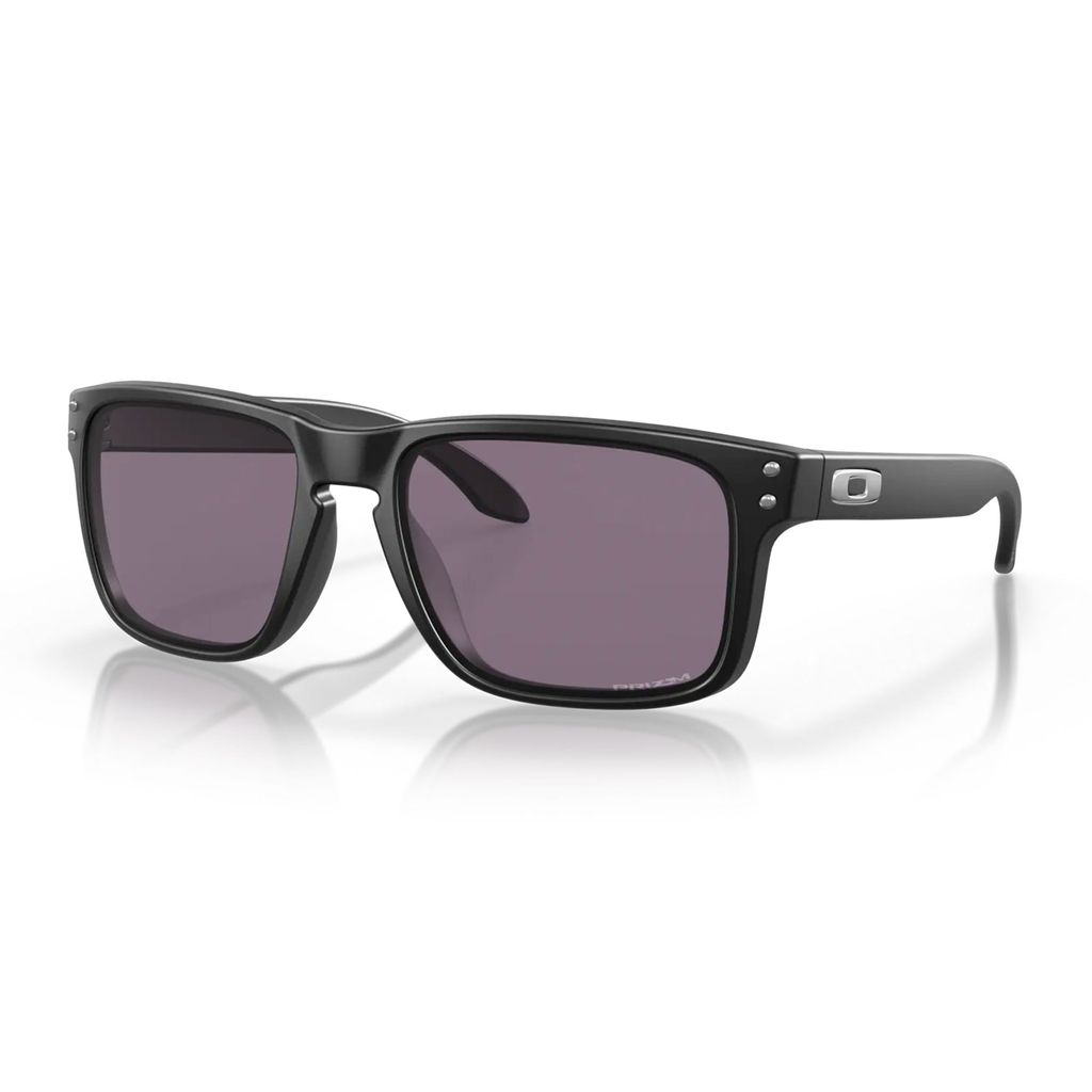 A pair of black Oakley sunglasses with grey lenses, shown from the front-left on a white background.