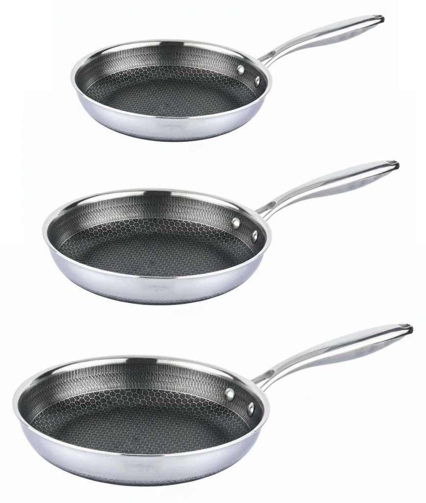 Three stainless steel frying pans with honeycomb pattern interiors are stacked vertically against a white background.