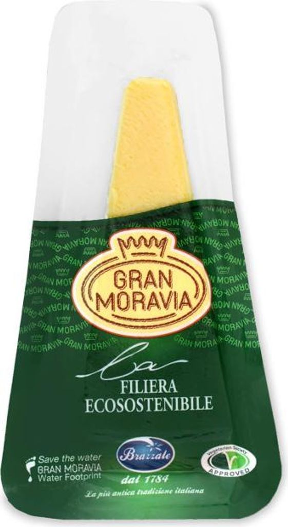 A wedge of Gran Moravia cheese in vacuum-sealed packaging.