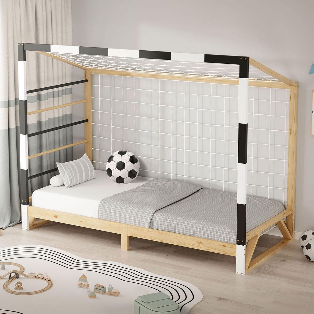 A child's bed designed to look like a soccer goal, set up in a bedroom.