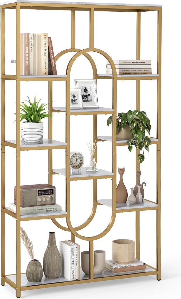 A gold and white geometric bookshelf filled with decorative items.