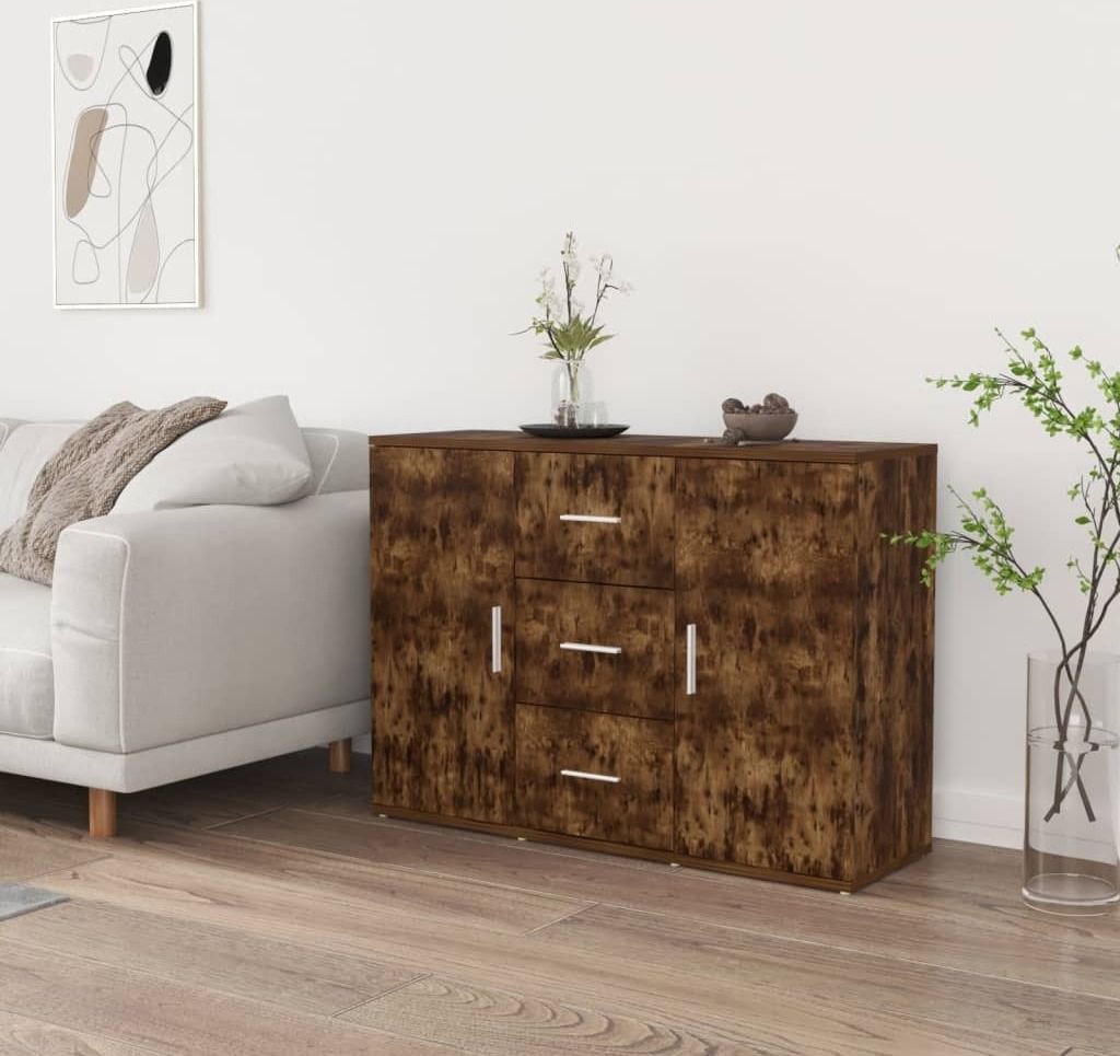 A sideboard in a living room setting next to a sofa.