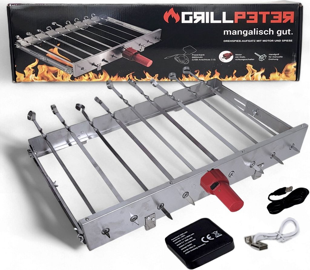 A stainless steel rotisserie grill with skewers, a red handle, and accessories like a power bank and cables, displayed on a white background with a box in the background.