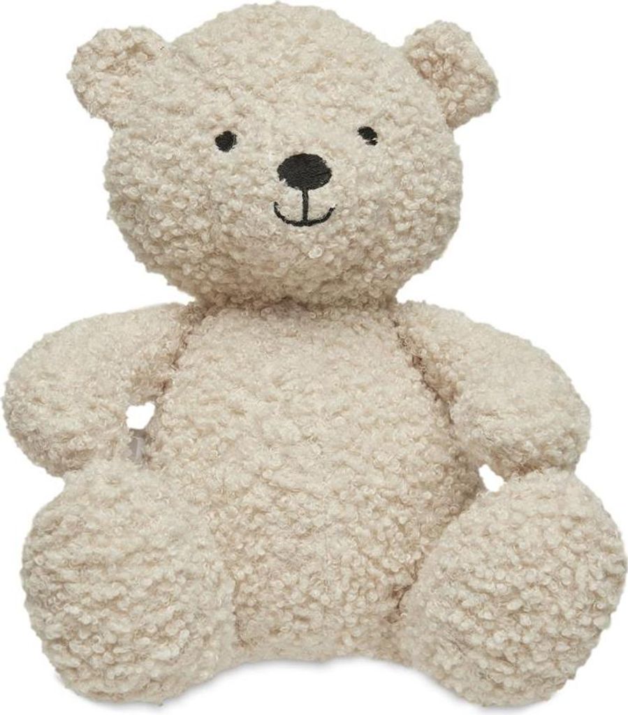 A fluffy, cream-colored teddy bear is shown from the front against a white background.