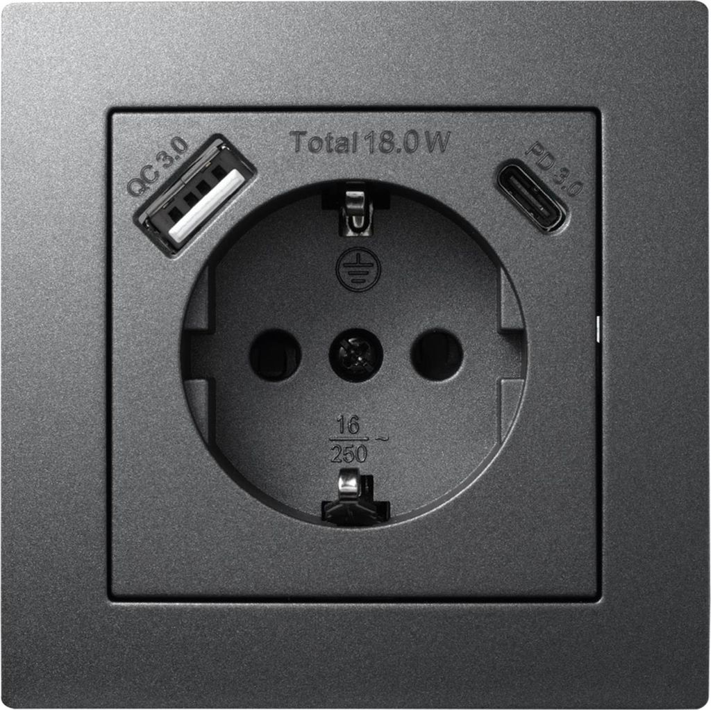 A close-up view of a wall socket with integrated USB ports.