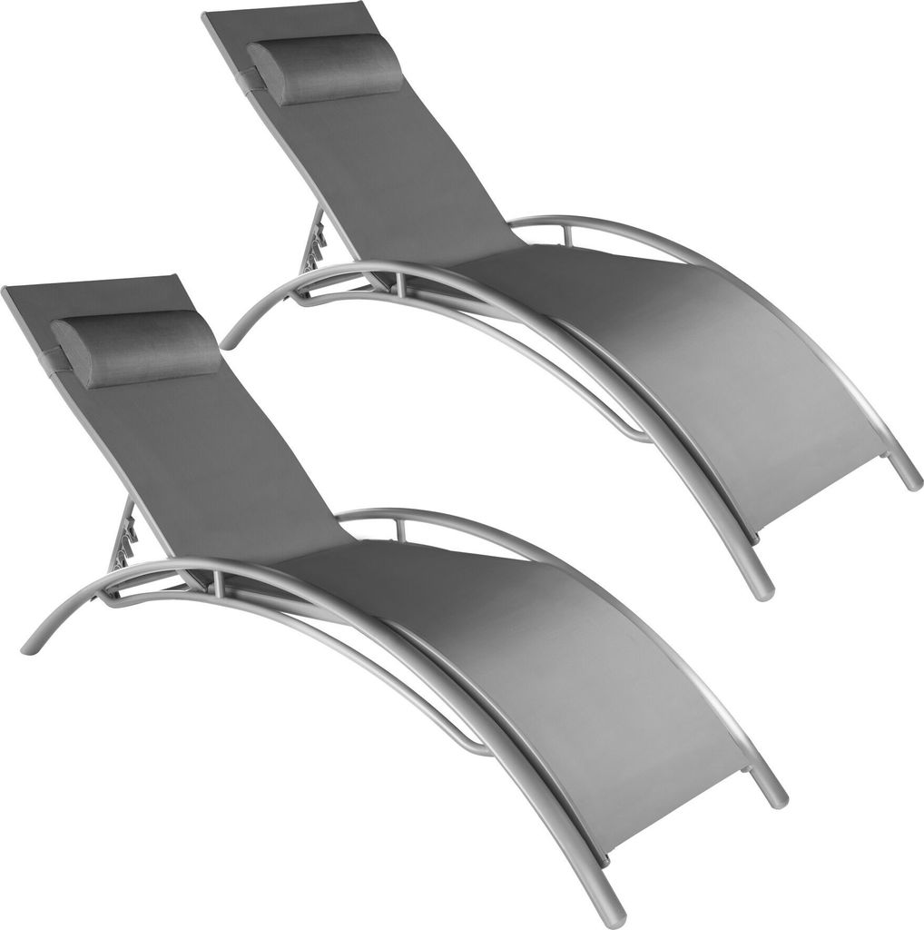 Two grey lounge chairs are shown against a white background.