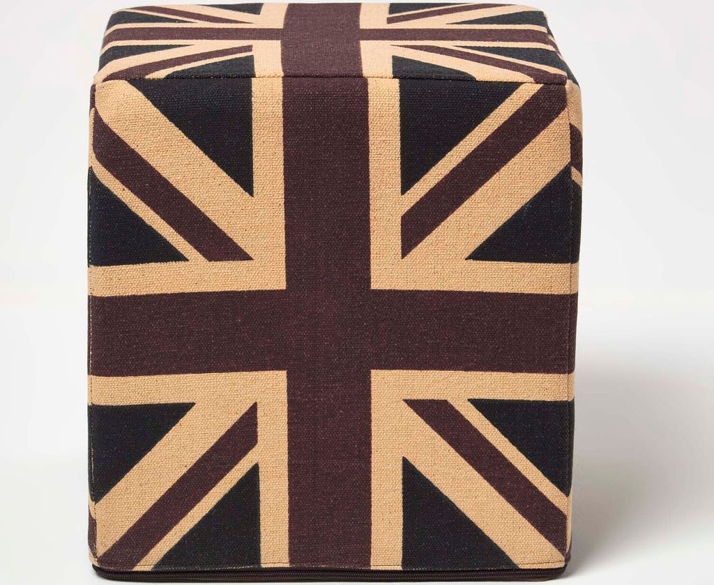 A cube-shaped ottoman with a Union Jack pattern.