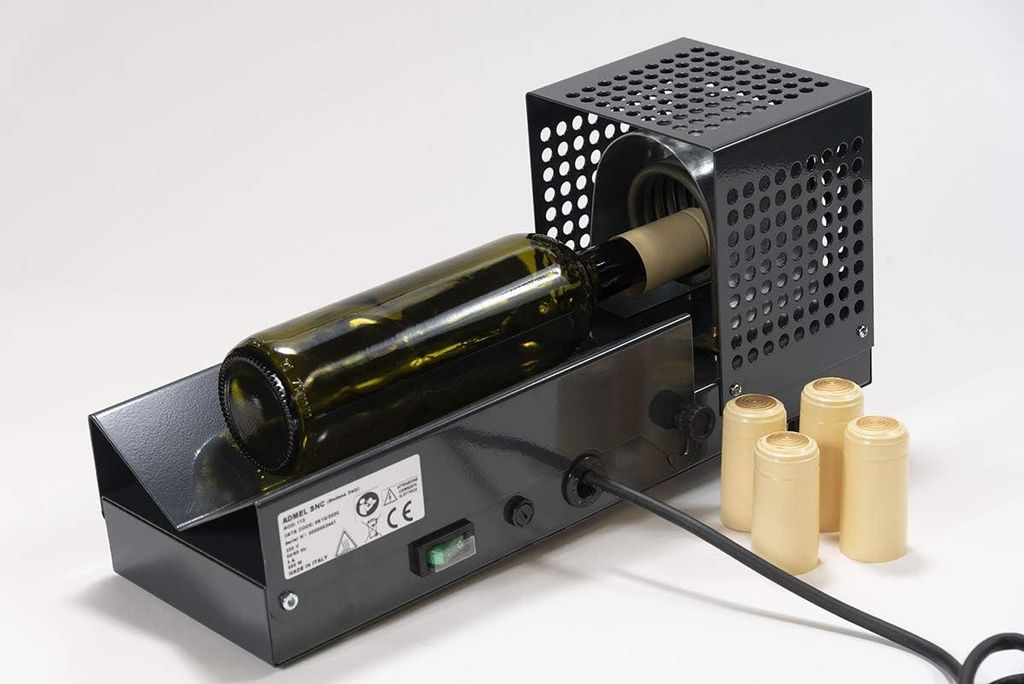 Kapselmaschine für Schrumpfkapseln für Wein- oder Ölflaschen.