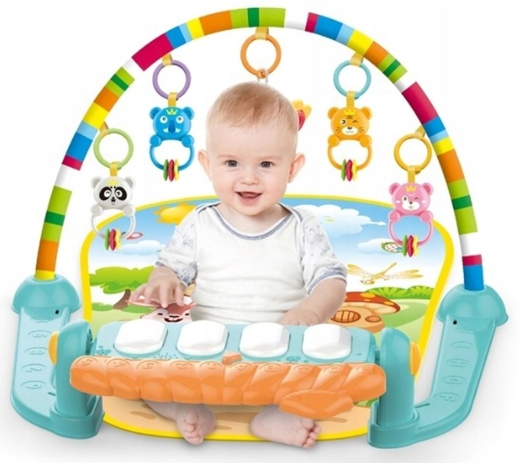 A baby is playing on a colorful activity mat with an interactive piano.
