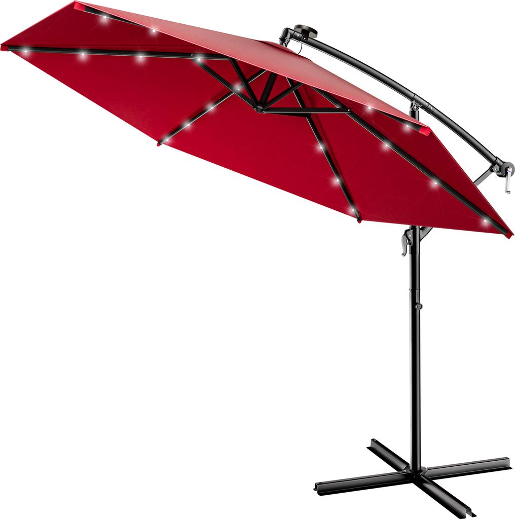 A red cantilever umbrella with solar-powered LED lights and a black stand.
