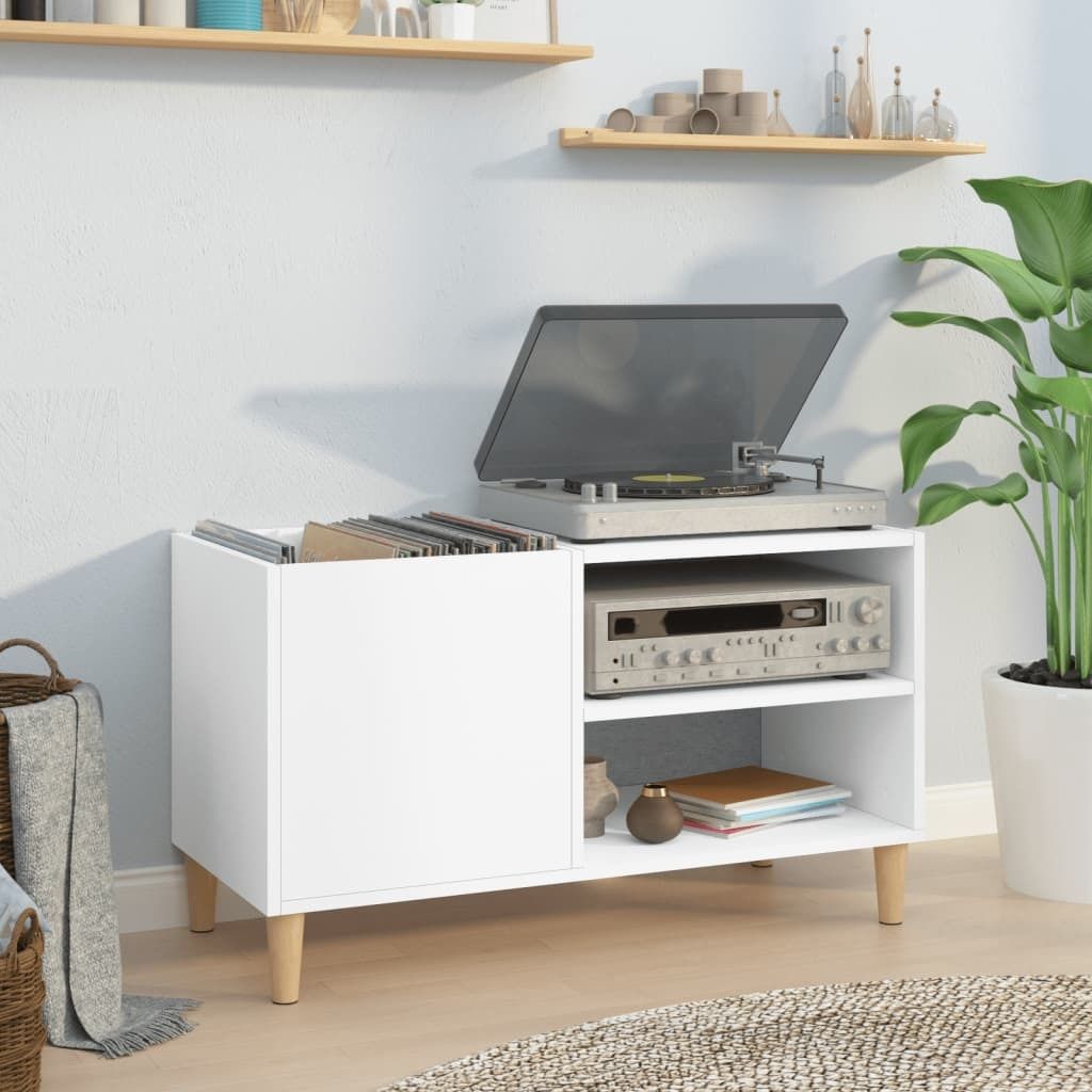 A white media console with a record player and receiver on top, and records stored inside.