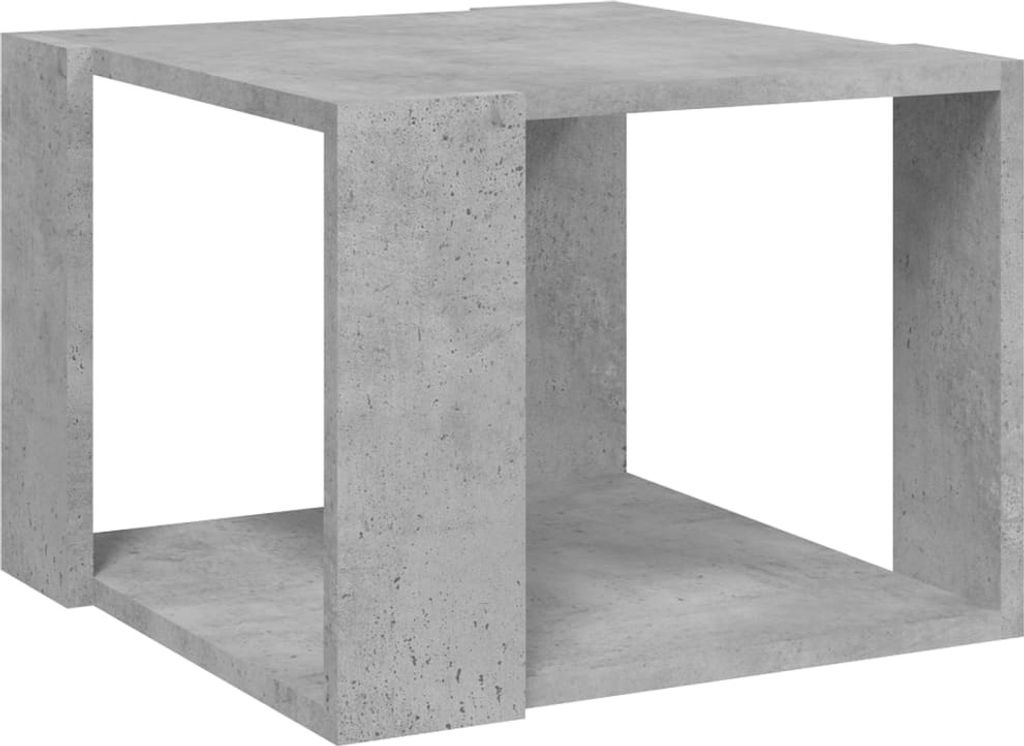 A concrete cube-shaped table or shelf.