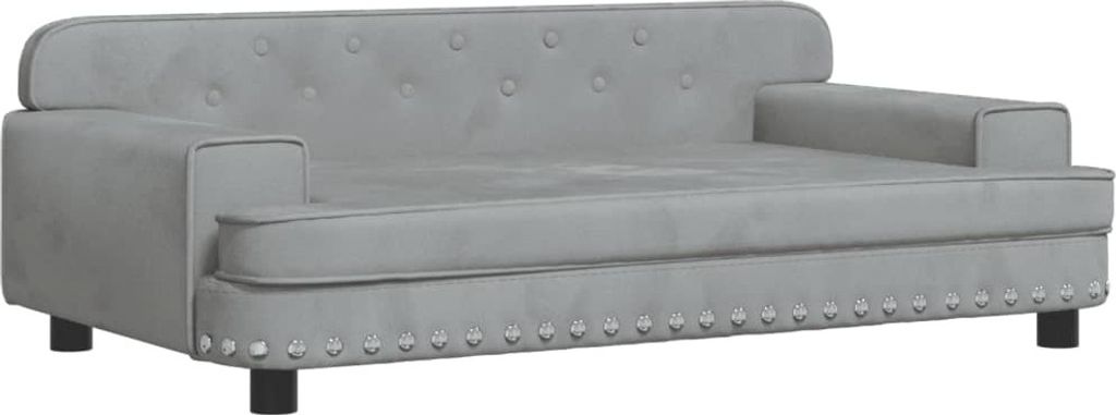 A light gray velvet dog sofa with tufted backrest and studded trim.