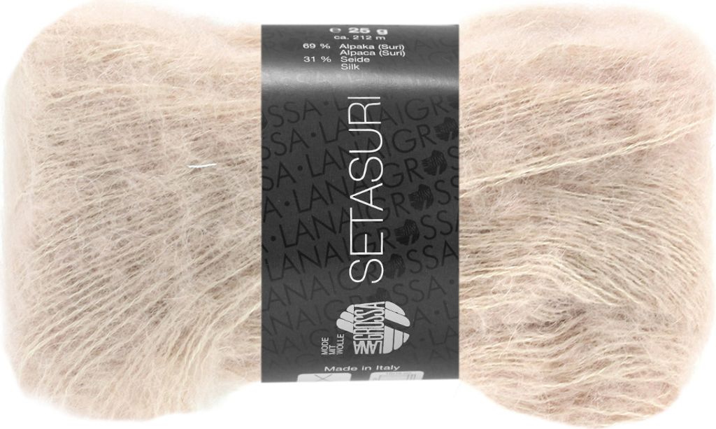 A ball of beige yarn with a black label.
