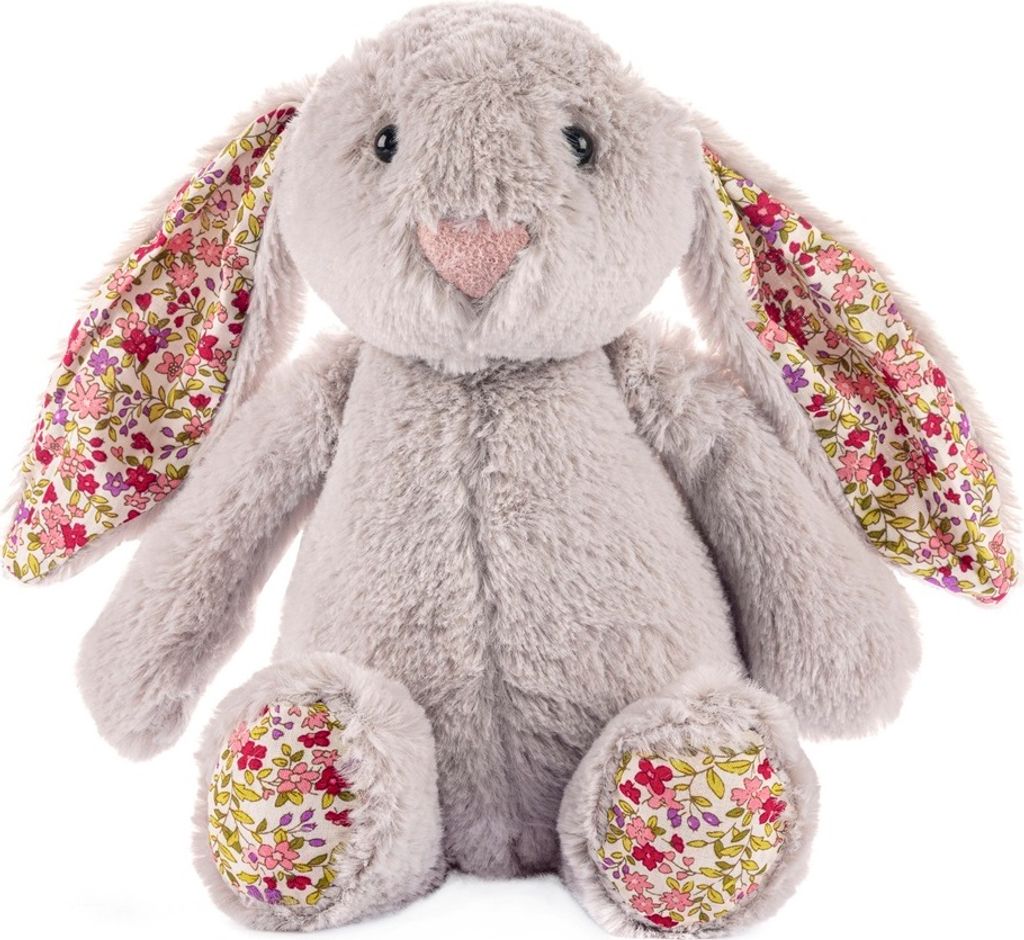A plush bunny toy is sitting down, facing the camera.