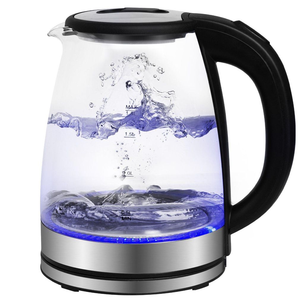 A glass electric kettle with water boiling inside, illuminated by blue LED lights at the base.
