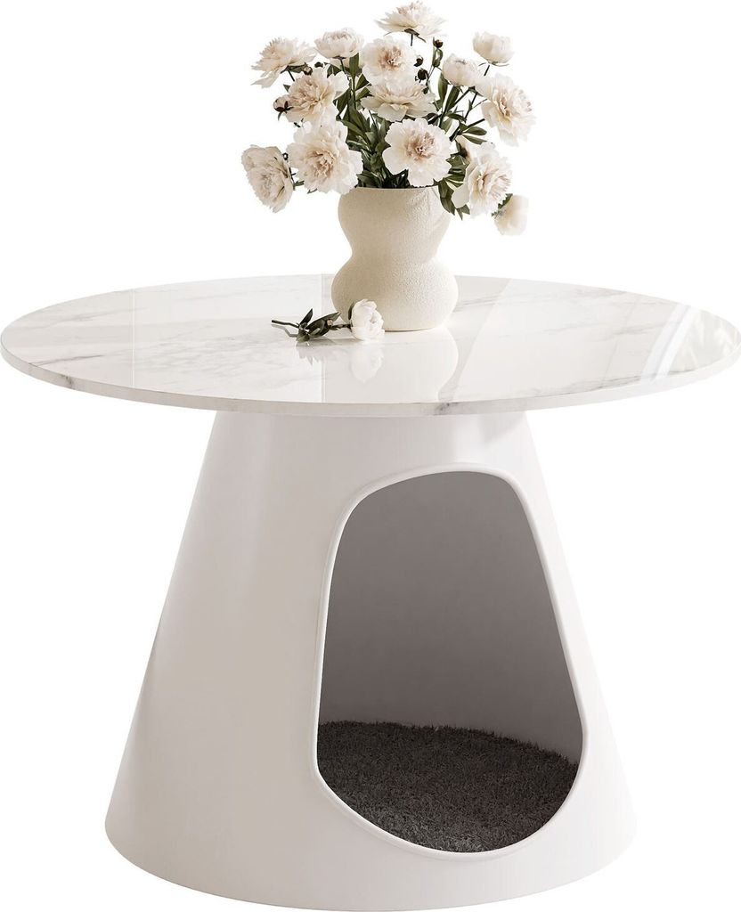 A white, conical table with a marble-effect top, featuring a cutout opening at the base that contains a gray pet bed. A vase of white flowers sits on top of the table.