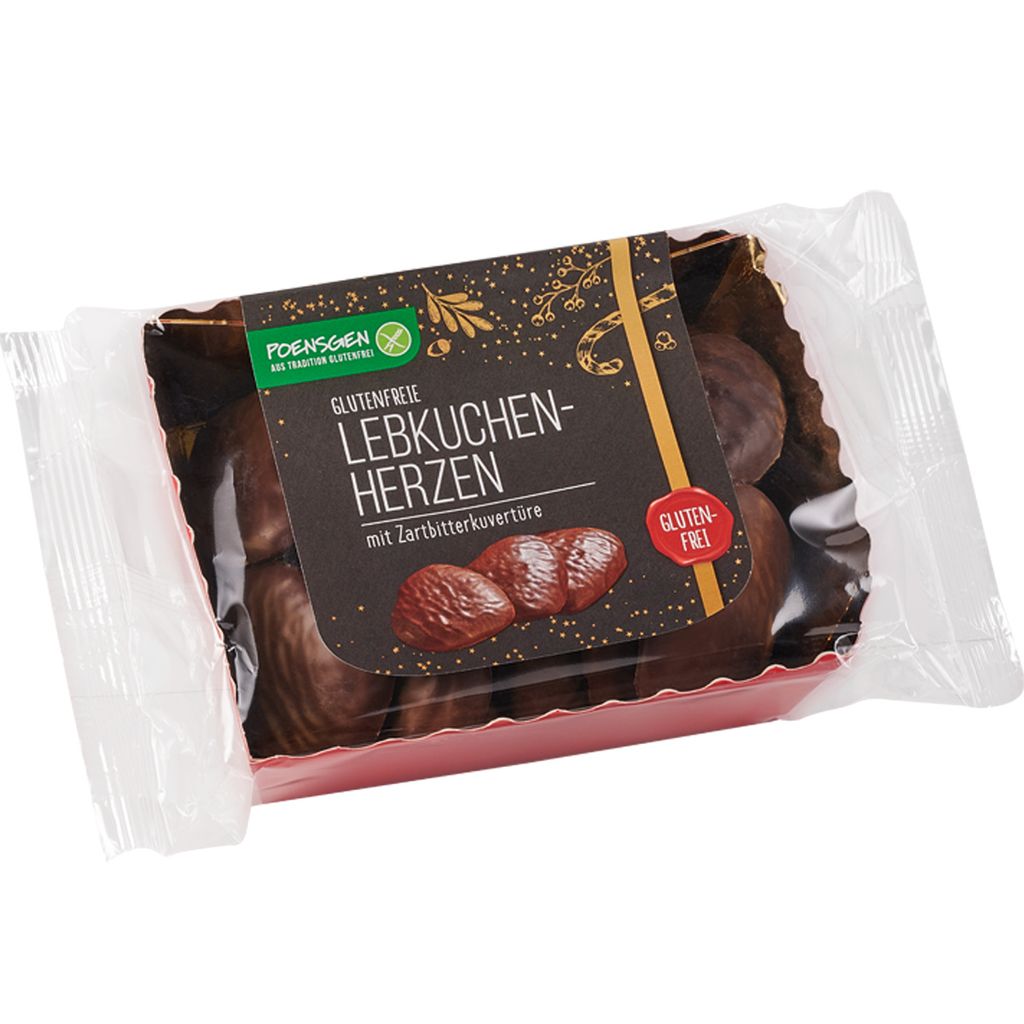 A package of gluten-free gingerbread hearts with dark chocolate coating.