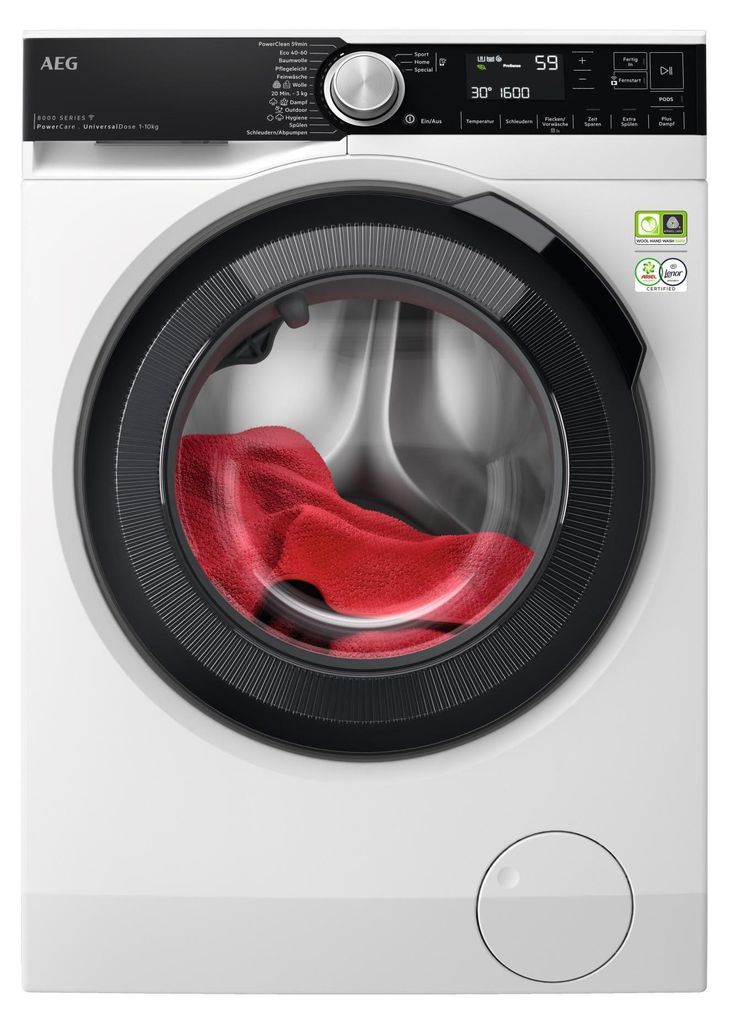 A front view of a white AEG washing machine with a red towel inside the drum.