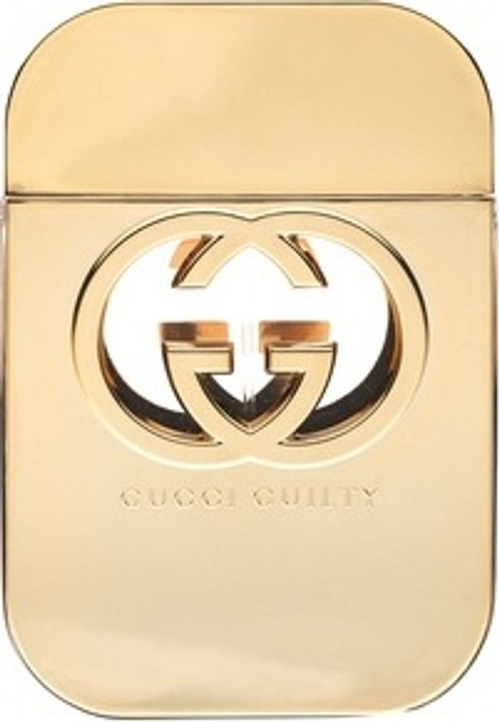 A close-up studio shot of a gold Gucci Guilty perfume bottle.