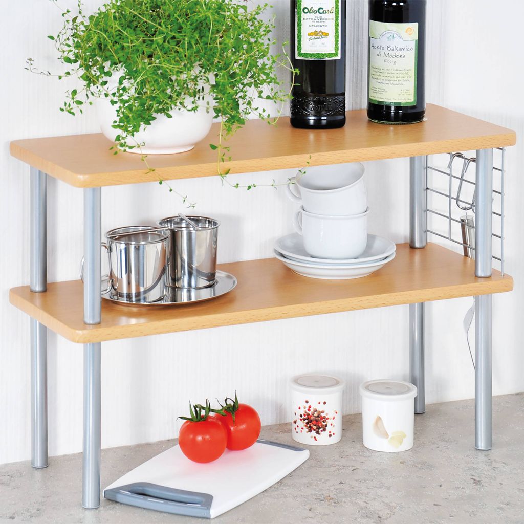 A two-tier kitchen shelf unit with various kitchen items on display.