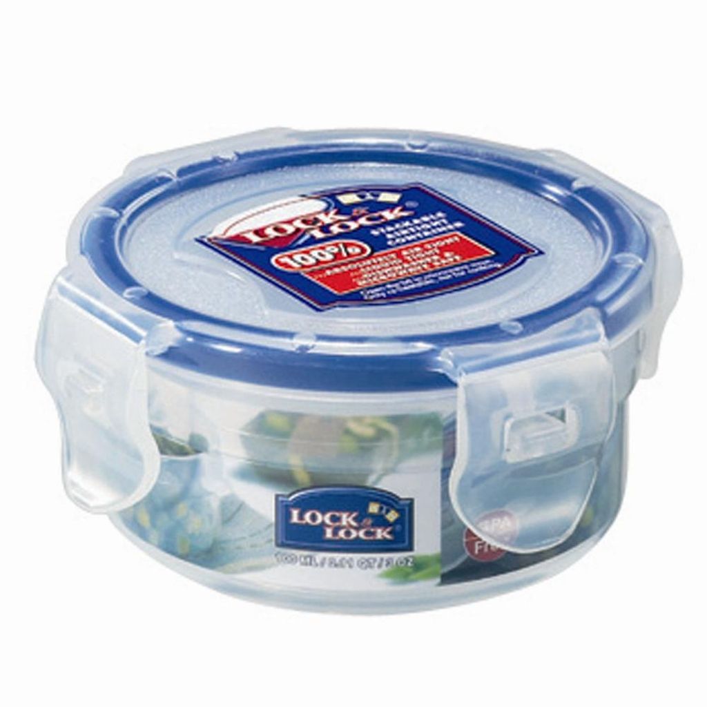 A round LocknLock food storage container with a blue lid and clear body, filled with some food items.