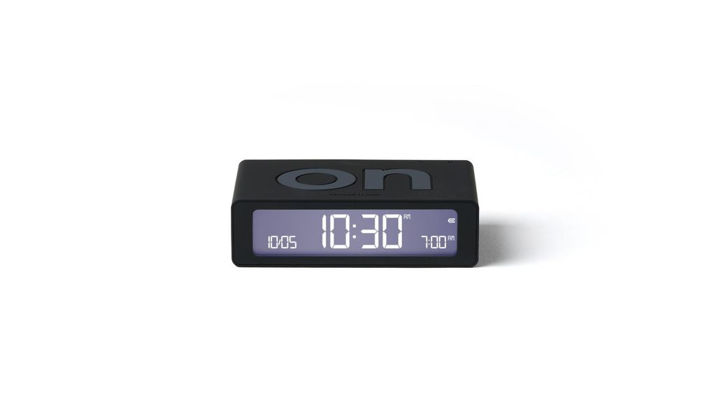 A black digital alarm clock is shown against a white background.