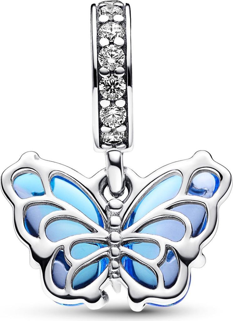 A close-up studio shot of a silver charm shaped like a butterfly with blue enamel wings.