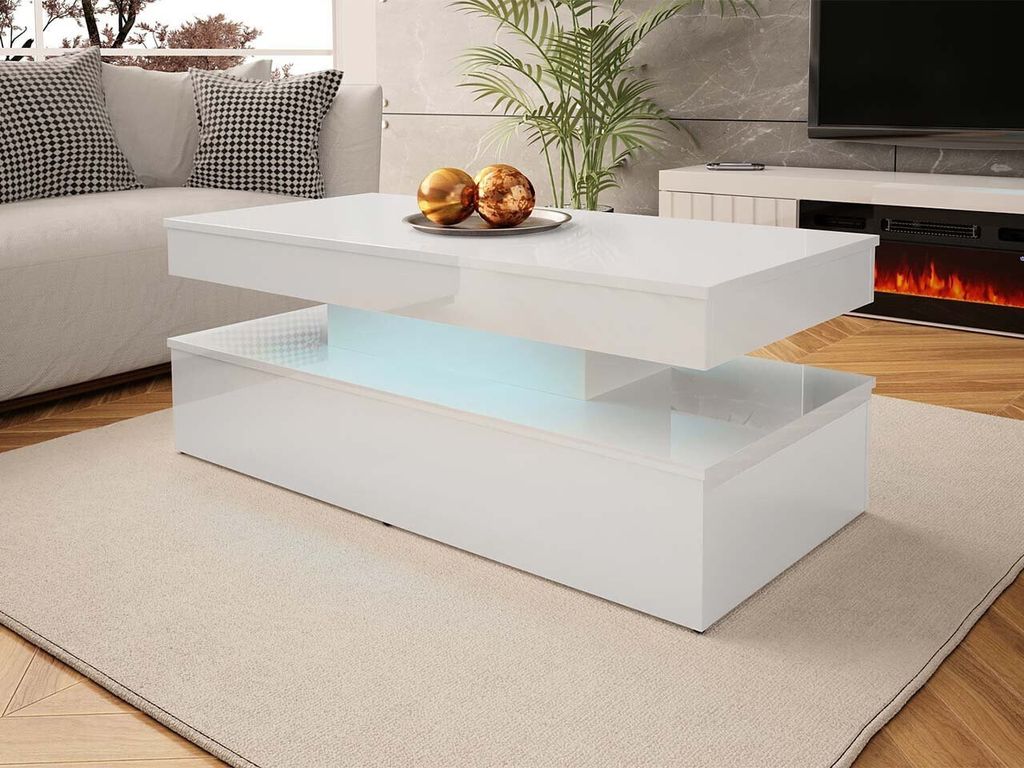 A modern white coffee table with LED lighting in a living room setting.