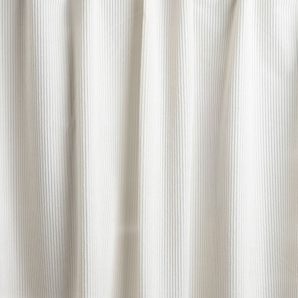 A close-up view of a beige curtain with vertical ribbed texture.