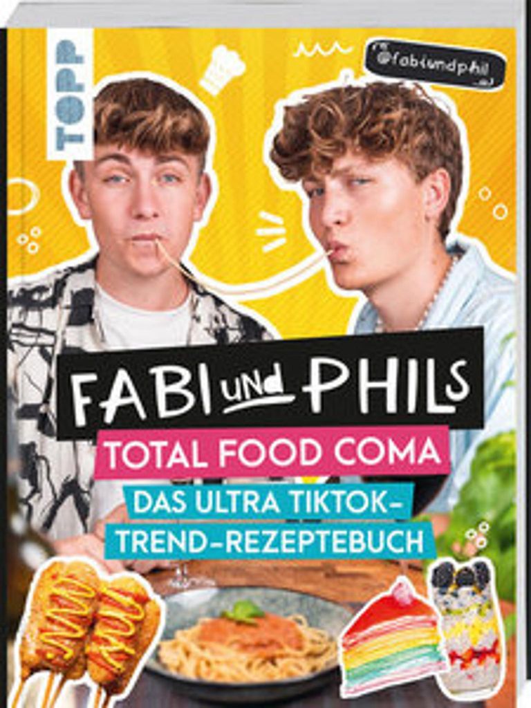 A cookbook cover featuring two young men and various food items.