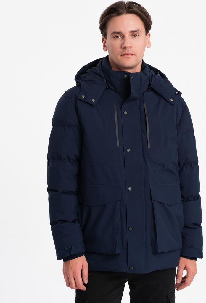 A man wearing a navy winter jacket.