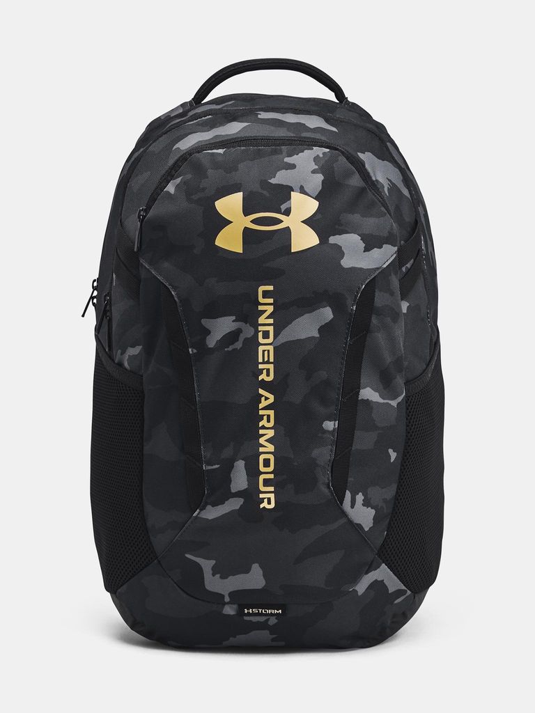 A studio shot of a black camouflage backpack with gold branding.