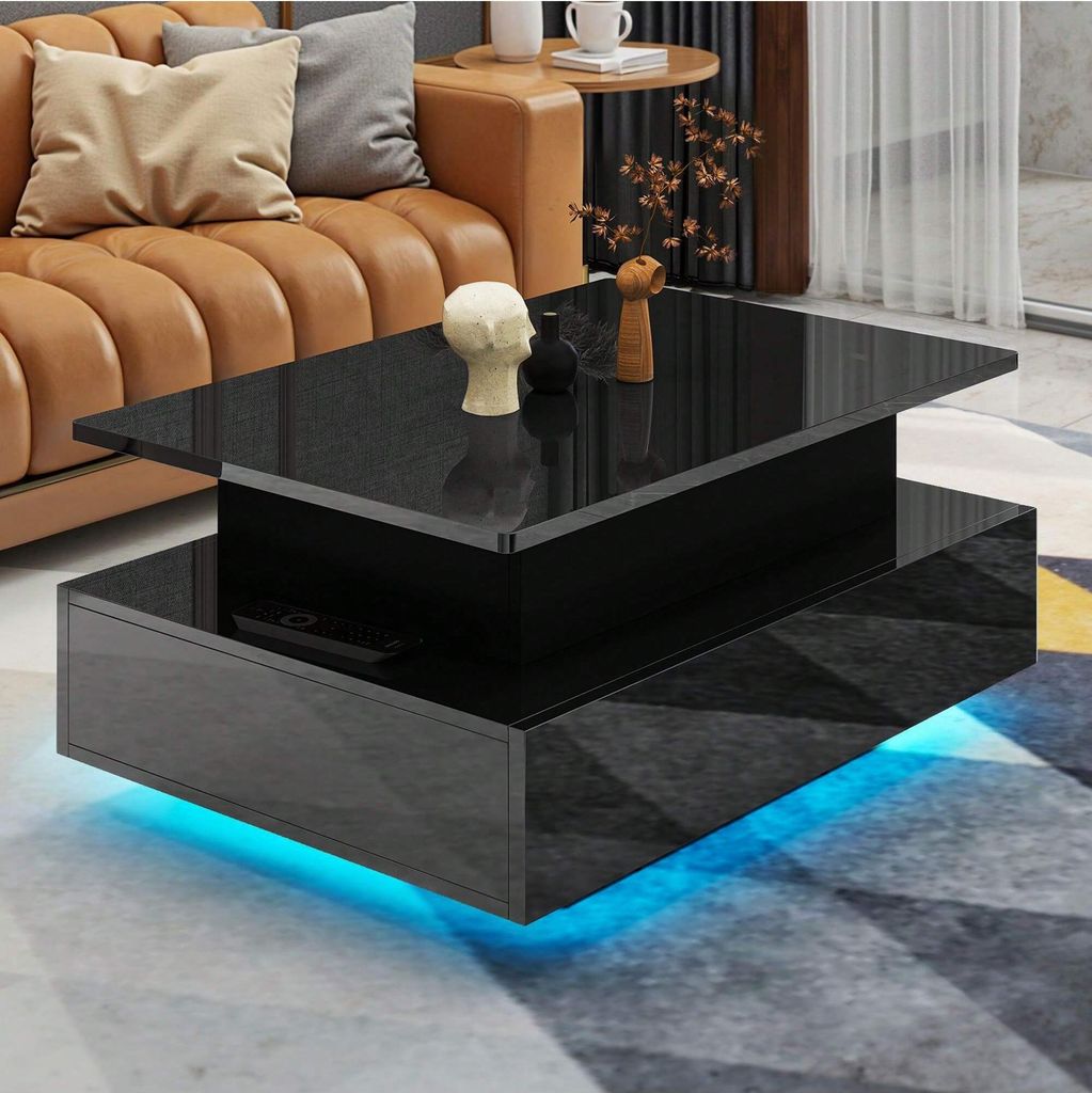 A modern living room scene featuring a black high-gloss coffee table with LED lighting, placed in front of a caramel-colored sofa.