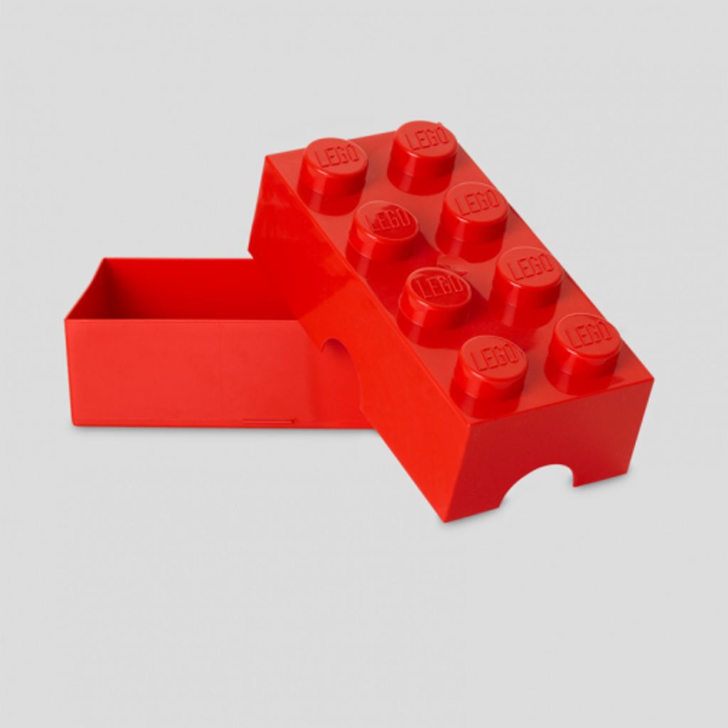 A red LEGO brick-shaped storage box with its lid partially open.