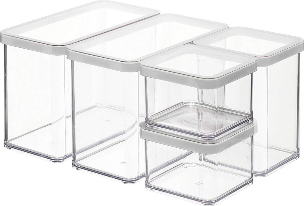 A set of five clear plastic food storage containers with white lids, arranged in a group.