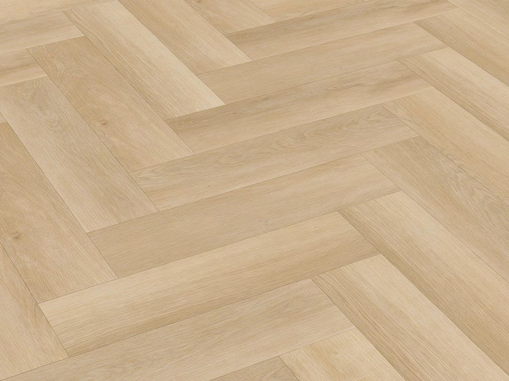 A close-up, angled view of a light-colored wooden floor laid in a herringbone pattern.