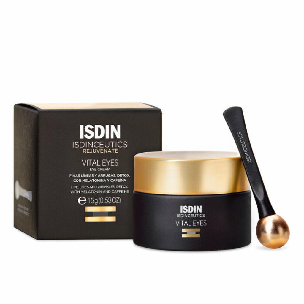 A product shot of an eye cream jar and its box, with an applicator.