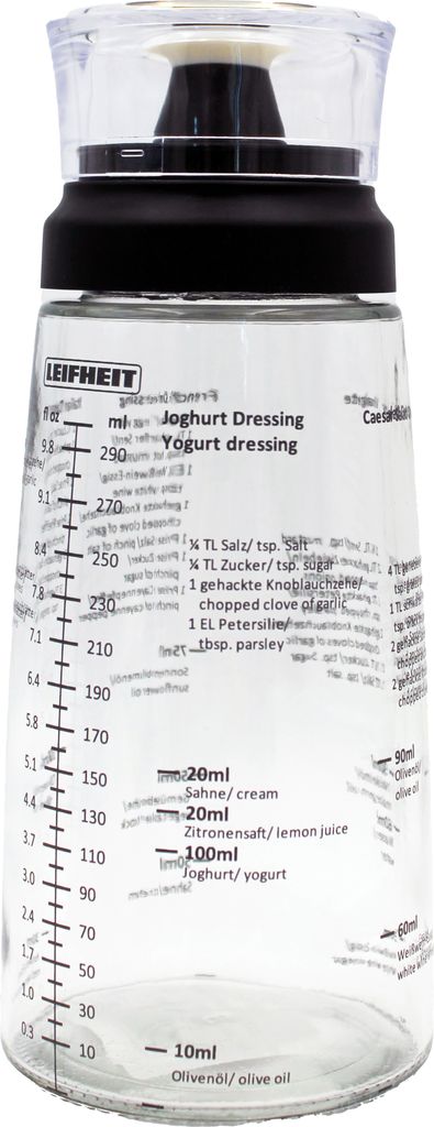 A clear studio shot of a salad dressing shaker.