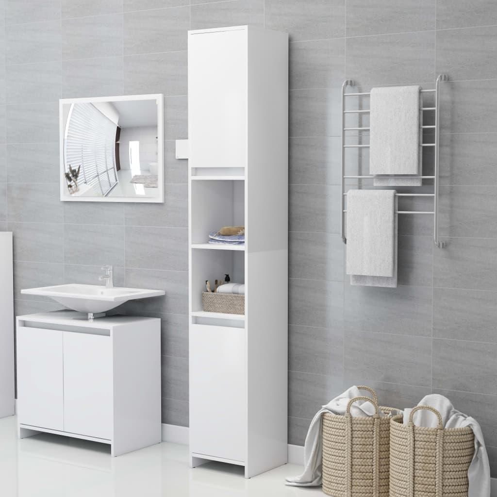 A clean, modern bathroom with white furniture and grey tiled walls.
