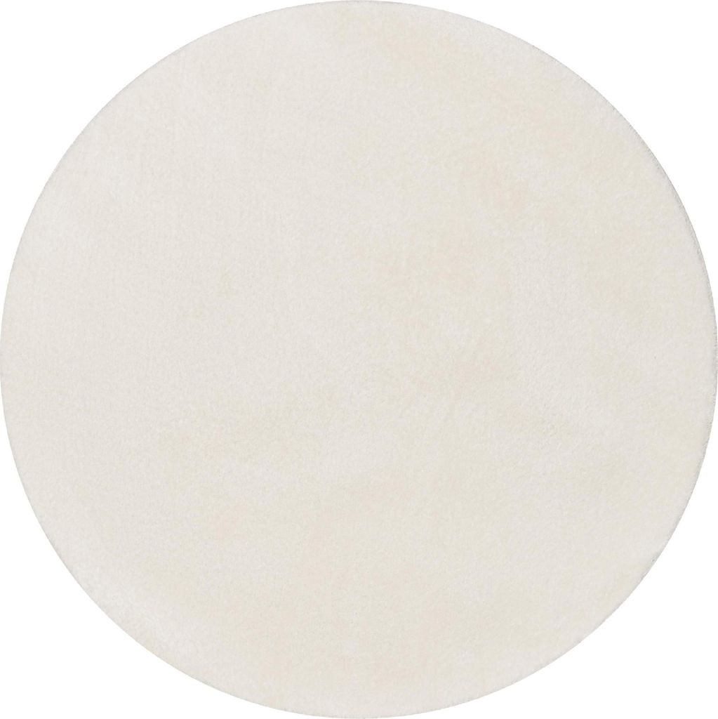 A round, cream-colored rug is shown against a white background.
