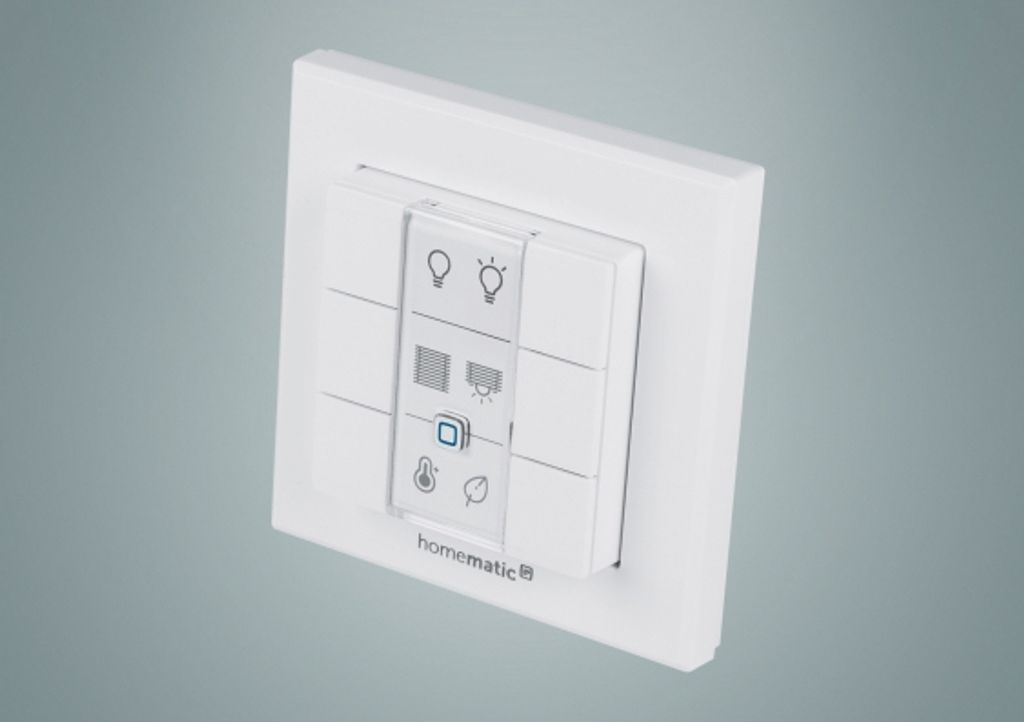 A white wall-mounted smart home control panel with multiple buttons and icons.