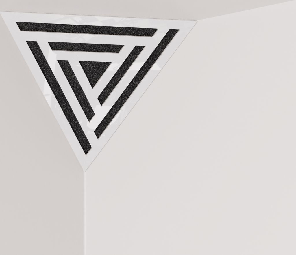 A triangular acoustic foam panel with a patterned insert, placed in the corner of a room.