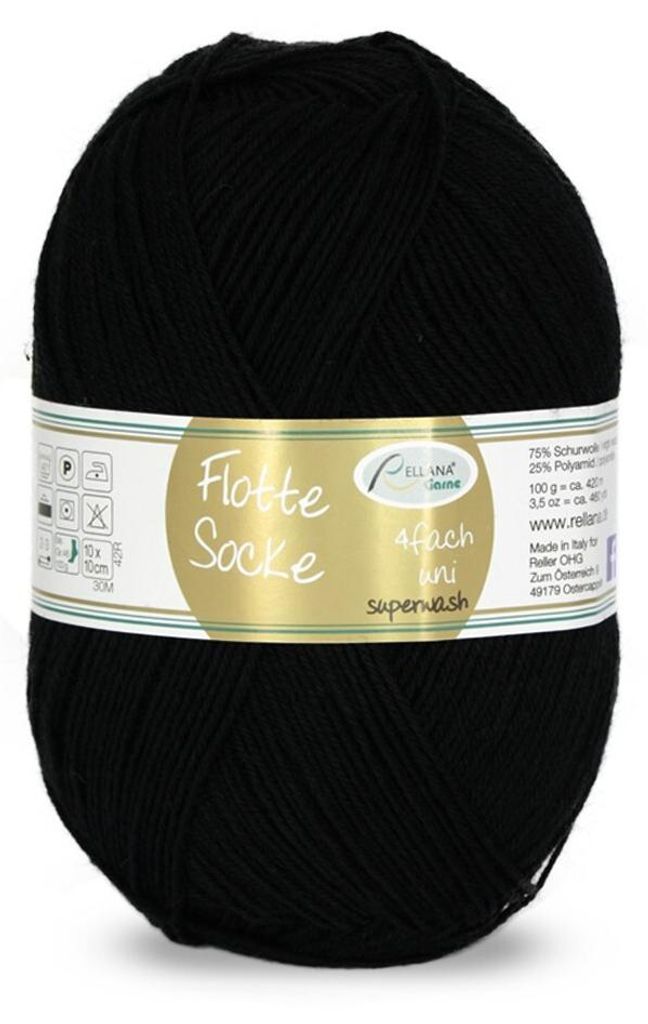 A ball of black yarn with a label wrapped around it.