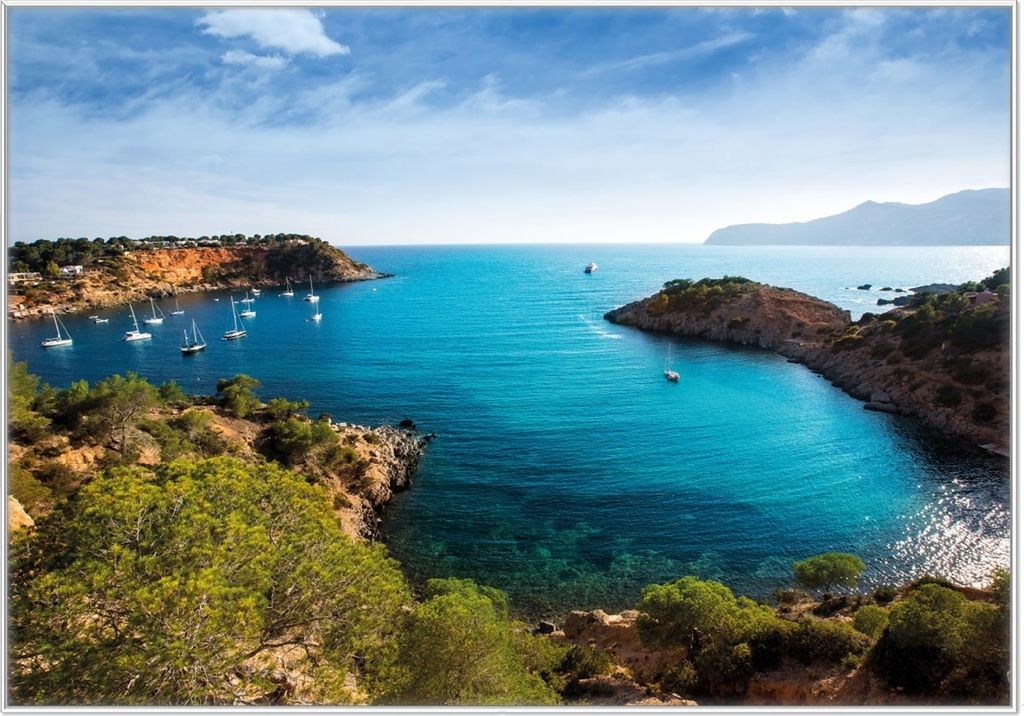 Wallario Wandbild Ibiza - Blick von einer Bucht aufs Meer, Größe: 70,30 x 100,30 cm, Poster mit weißem Kunststoffrahmen