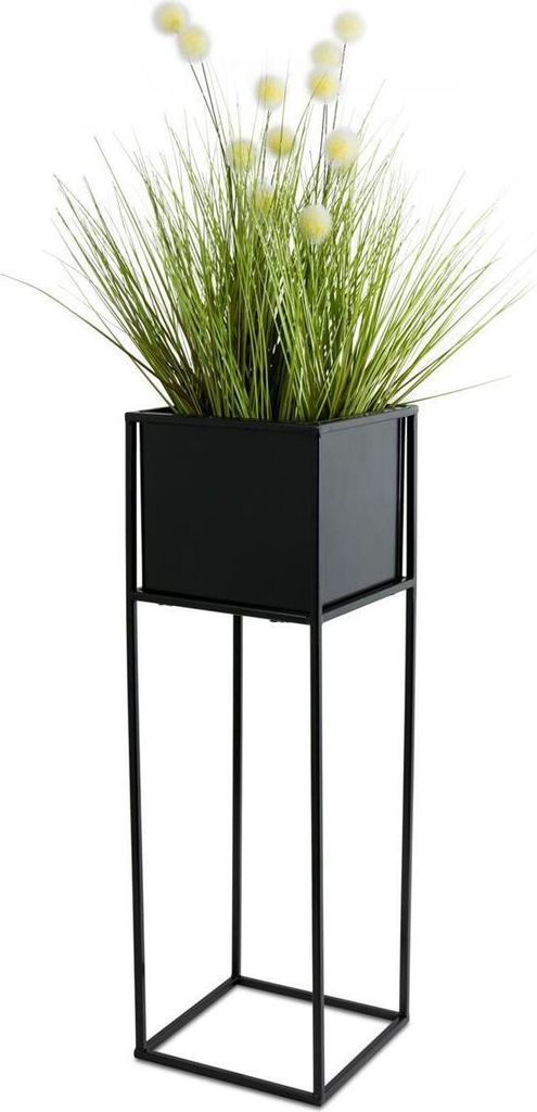 A black metal plant stand with a green potted plant.