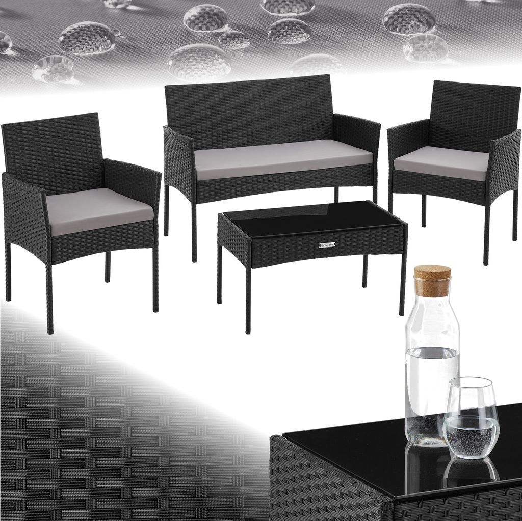 A black rattan garden furniture set with gray cushions, including a two-seater sofa, two armchairs, and a coffee table, displayed on a white background with water droplet graphics.