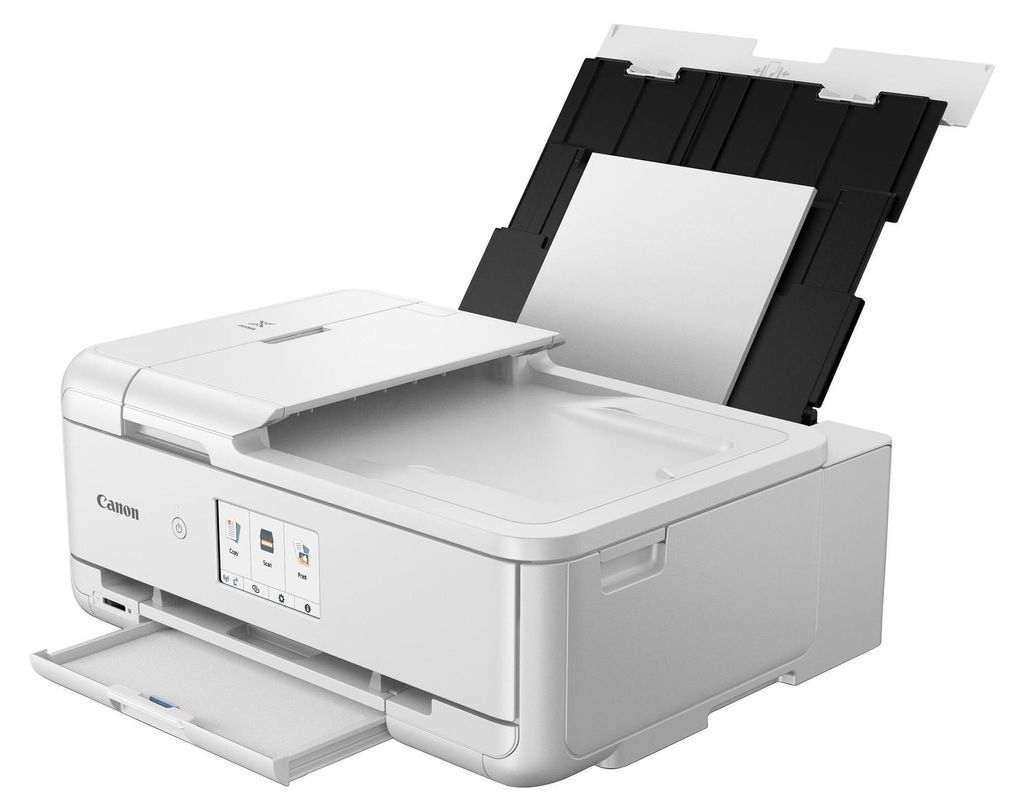 A white Canon PIXMA TS9551Ca printer is shown from a three-quarter front angle with the scanner lid open and paper loaded in the automatic document feeder.